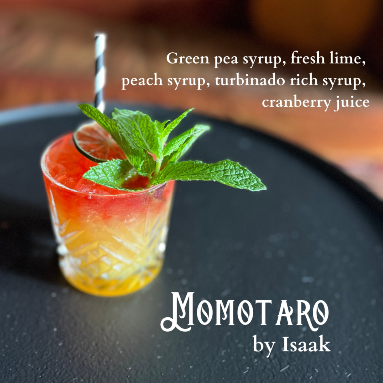 Momotaro mocktail in a rocks glass. Drink ingredients listed